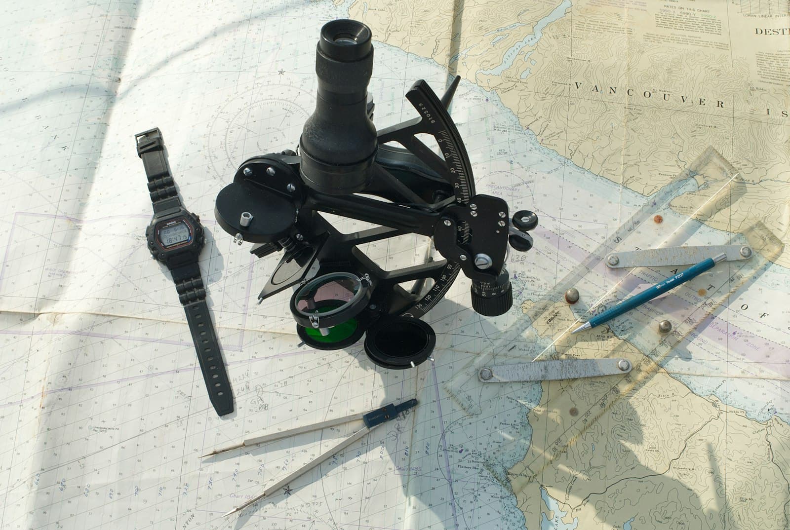 Nautical chart with dividers, ruler and sextant