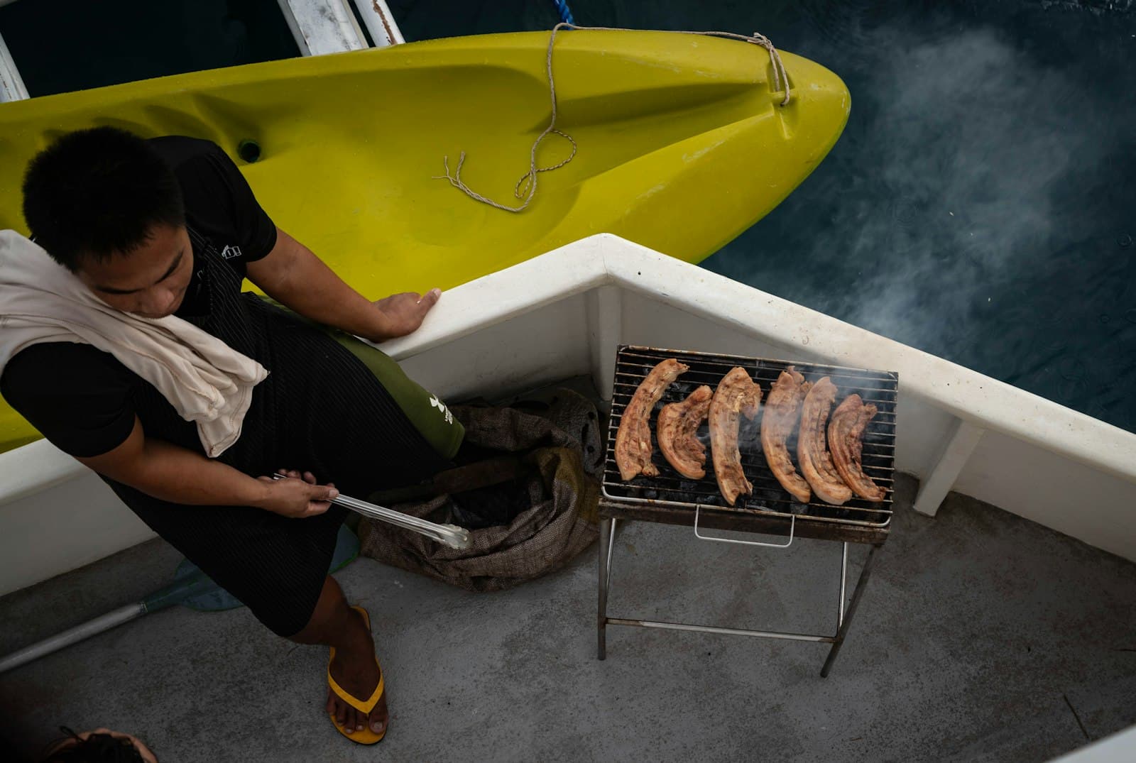 Meal being cooked on a boat deck
