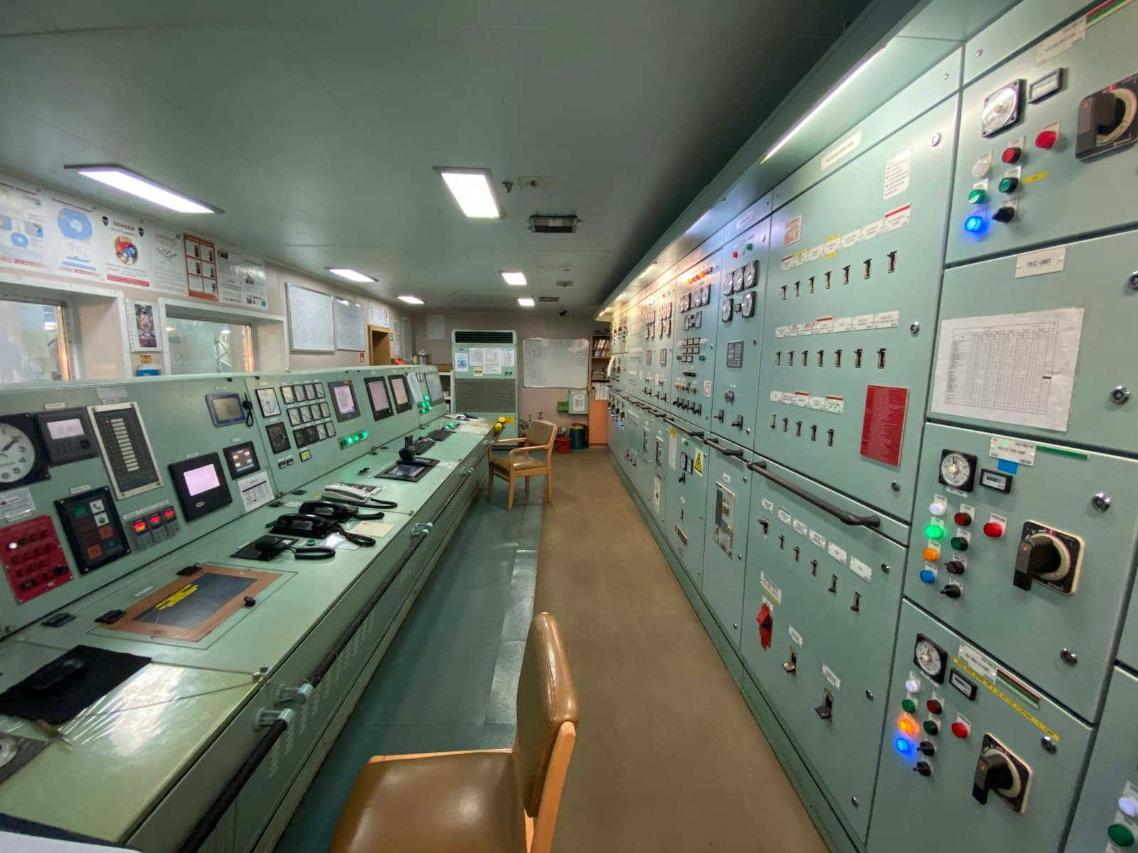 Engine room machinery aboard a ship