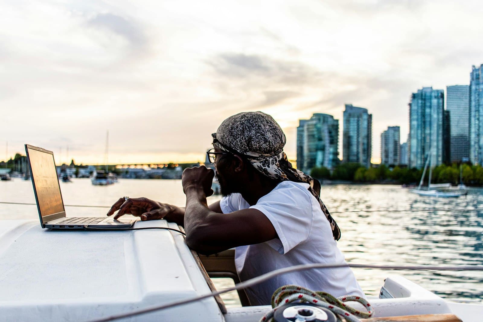 Person working on a laptop aboard a boat